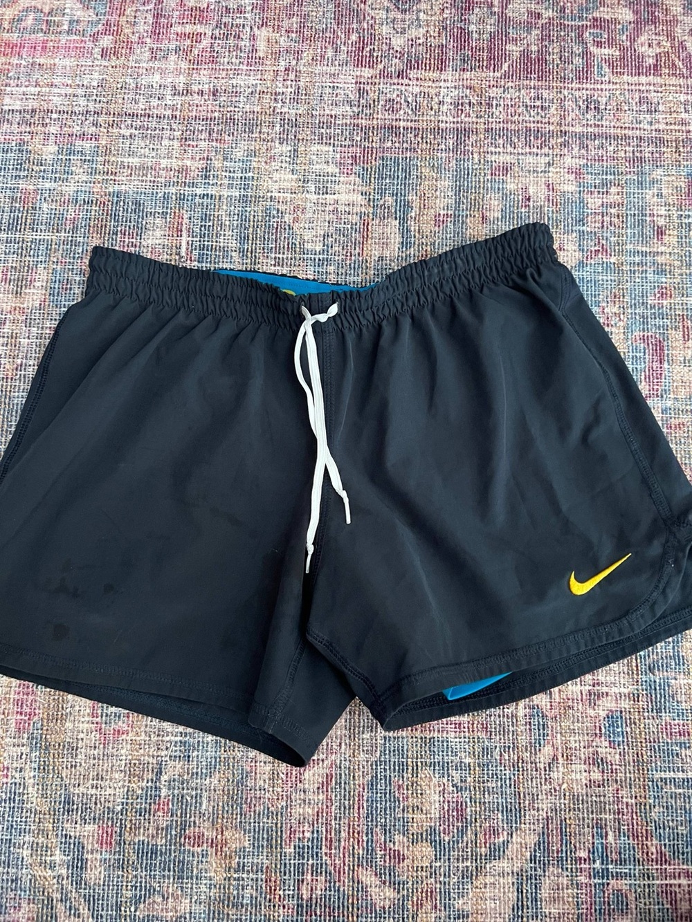 Nike Women’s Blue Athletic Shorts with Yellow Swoosh
